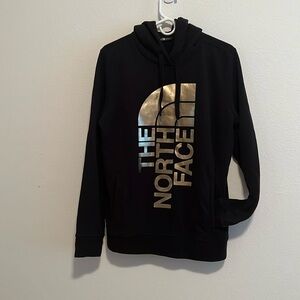 The North Face Black Hoodie with Metallic Gold Logo